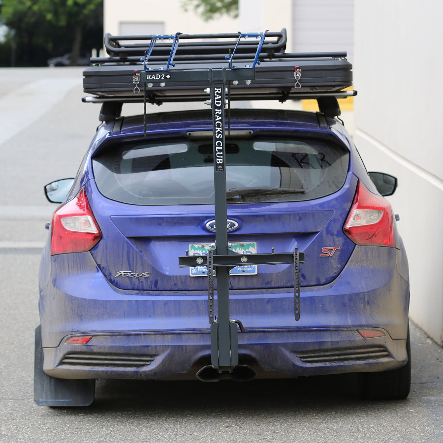 blue car with roof tent and bike rack RAD RACKS bike rack