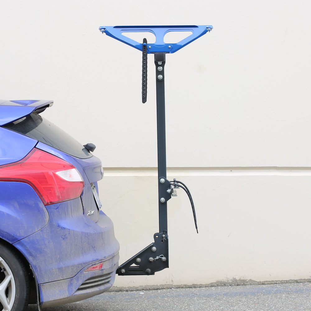 blue car with blue RAD RACKS bike rack
