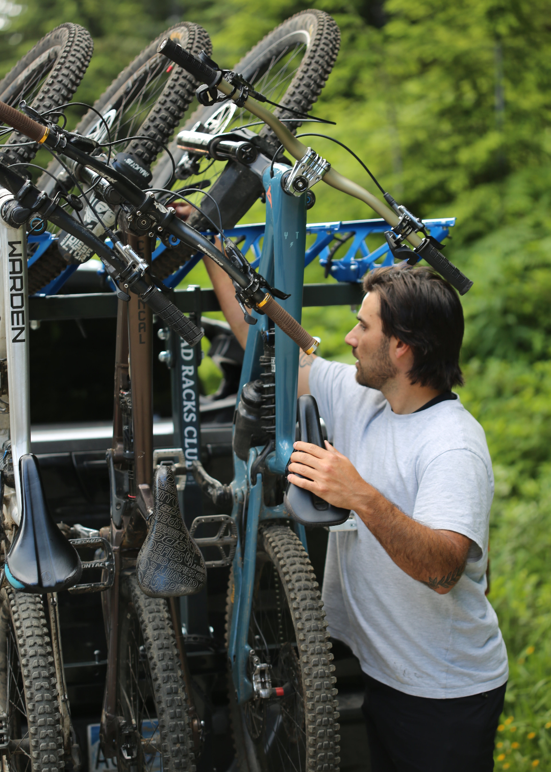 Person working on a bicycle with a green background