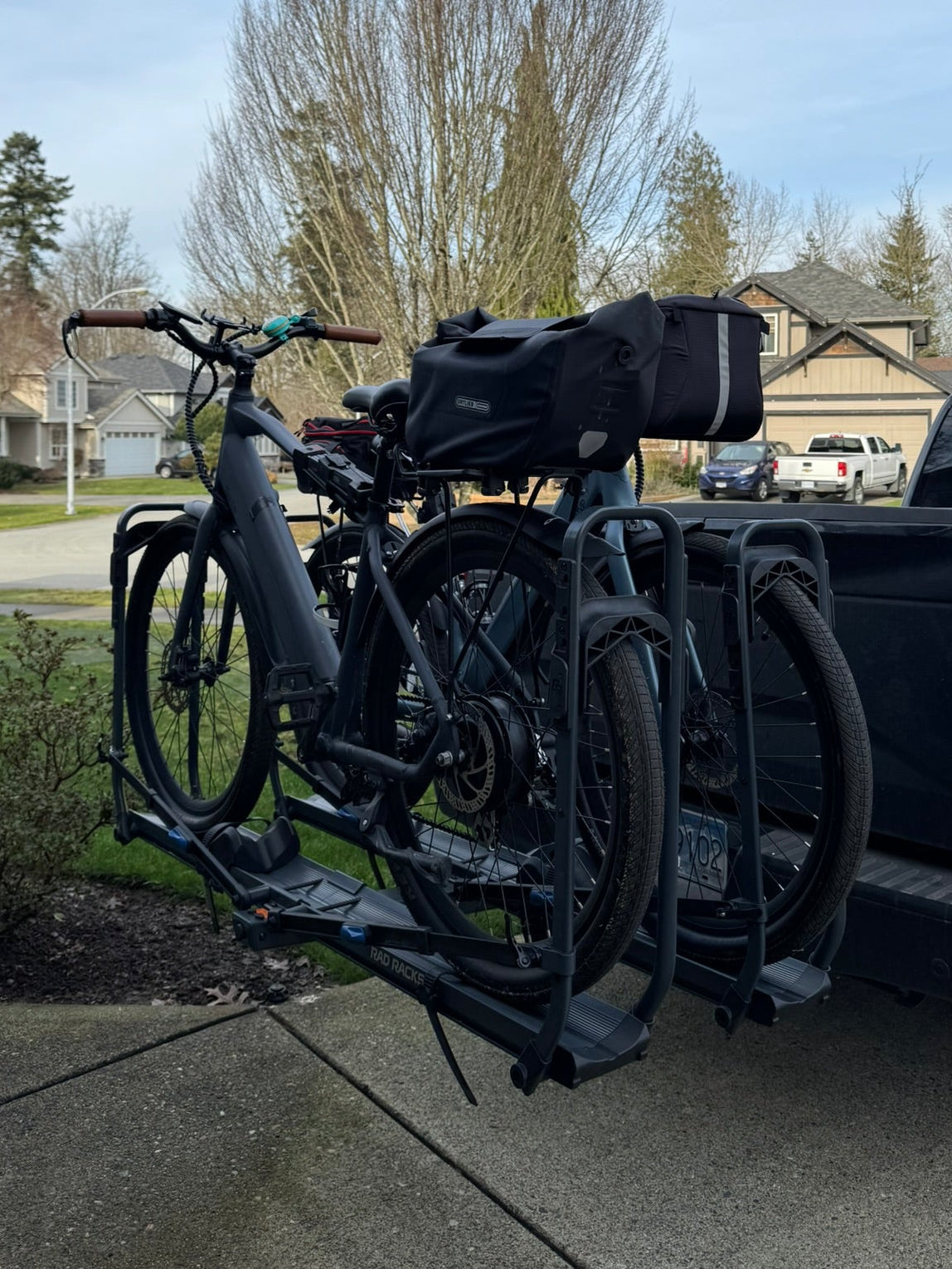 Bicycle attached to a pickup truck with a clear sky background. Ebike e bike e-bike on tray bike rack Rad Racks